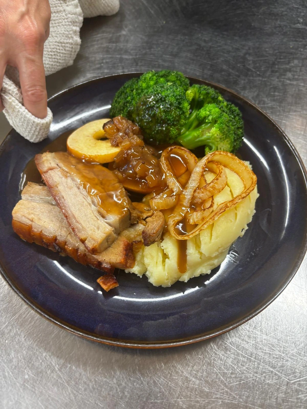 Pork dinner with mash, vegetables and gravy