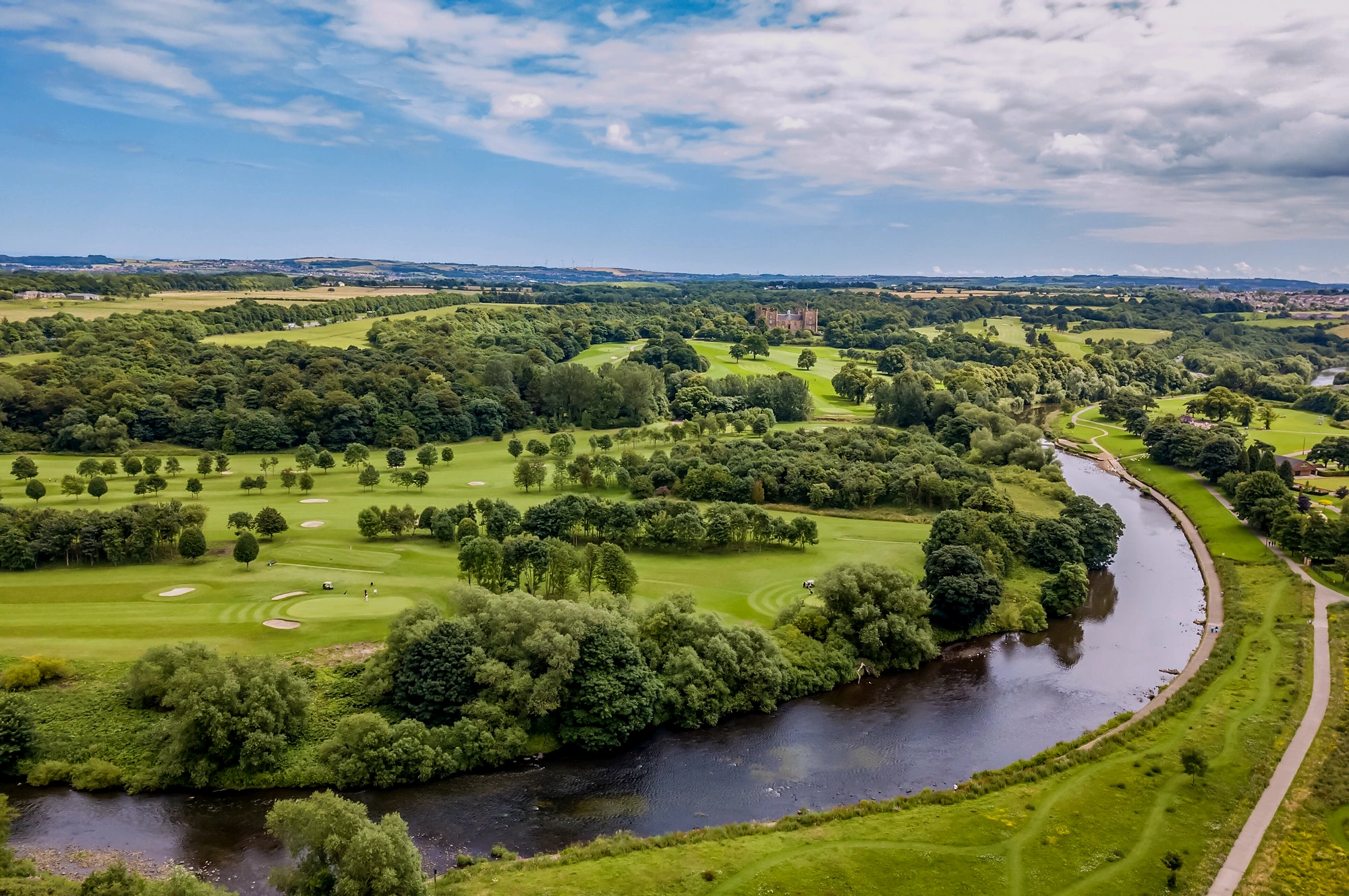 Green countryside beside the river