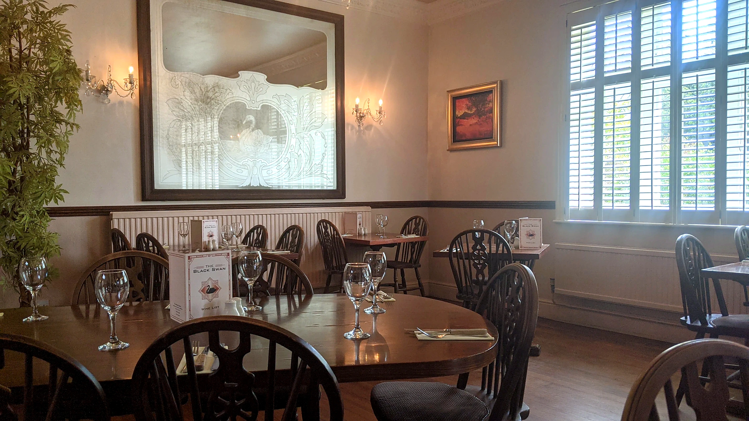 The Black Swan dining room set for service